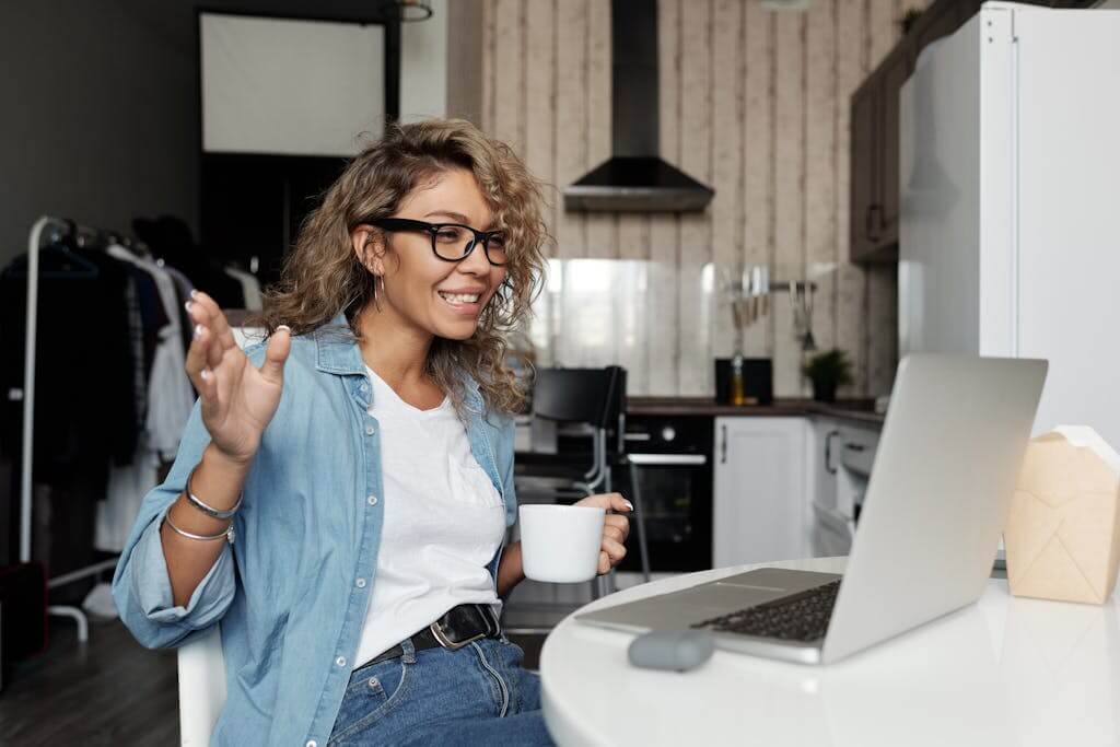 Woman Using Laptop Doing A Video Call